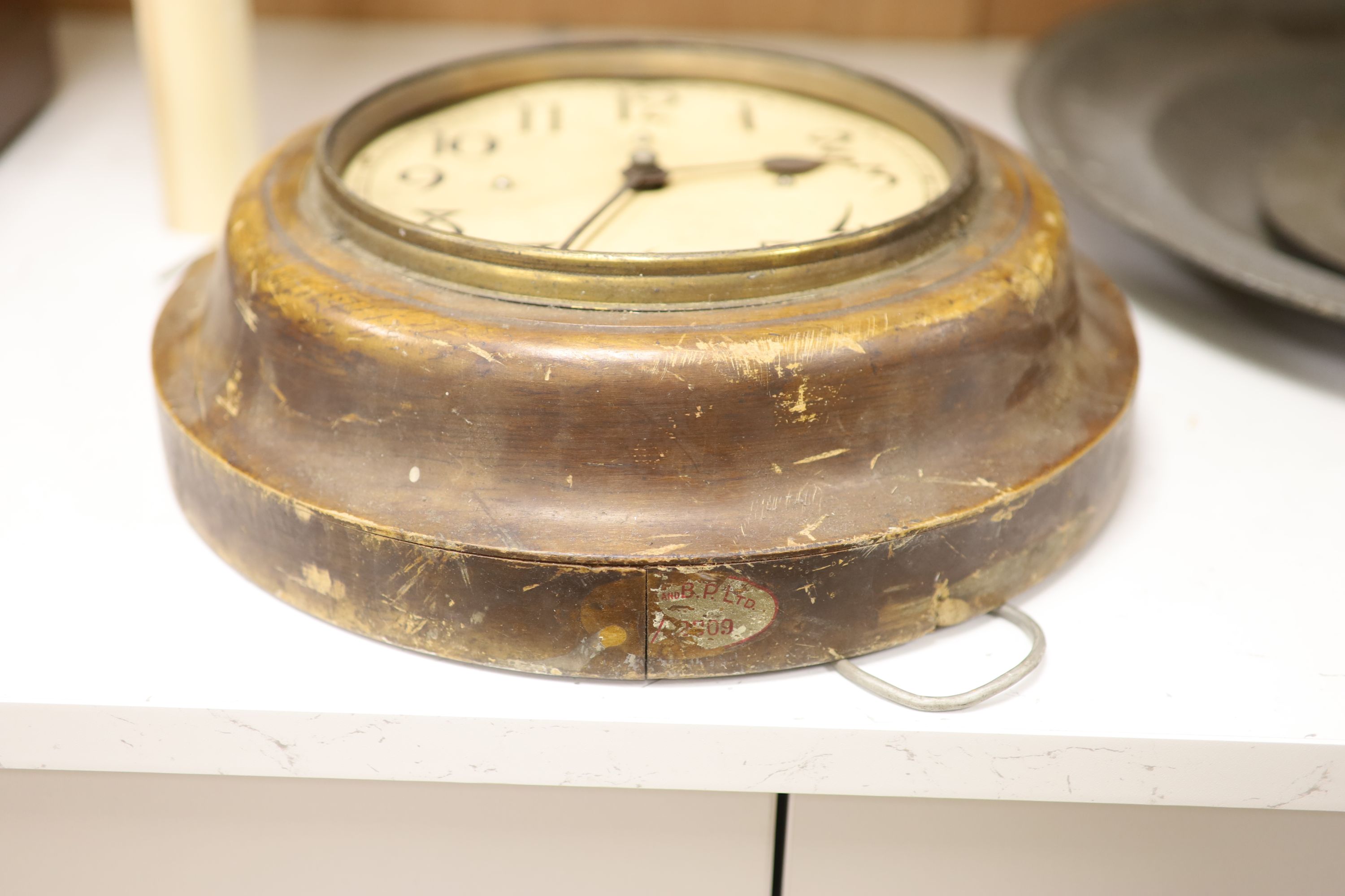 A stained wood electric slave dial, diameter 31cm